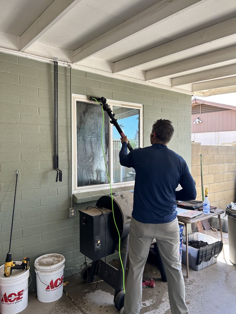Michael of Clear as Days cleaning windows with a water-fed pole in Phoenix AZ