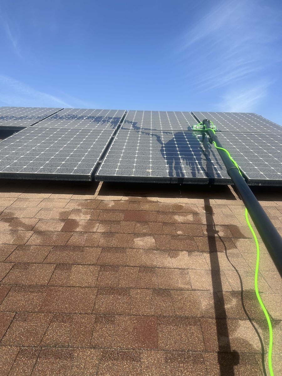 Water-fed pole cleaning rooftop solar panels in Arizona